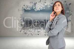 Composite image of worried businesswoman