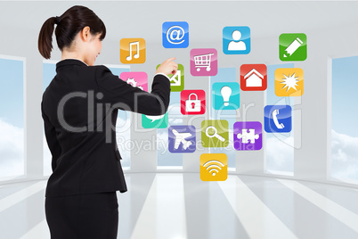 Composite image of businesswoman pointing