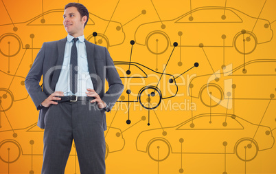 Composite image of cheerful businessman with hands on hips