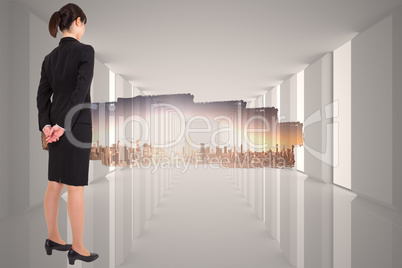 Composite image of businesswoman standing