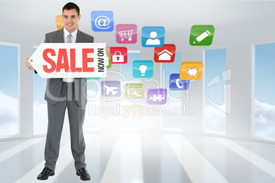 Composite image of businessman with signboard