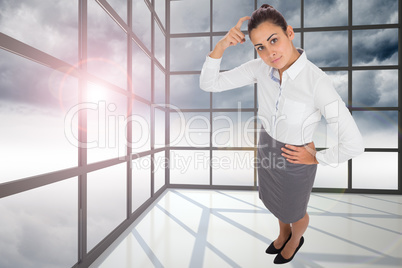 Composite image of focused businesswoman