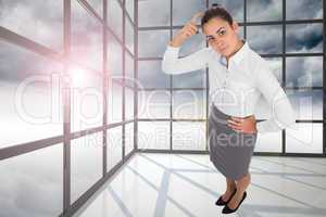 Composite image of focused businesswoman