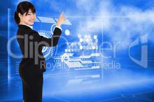 Composite image of smiling businesswoman pointing