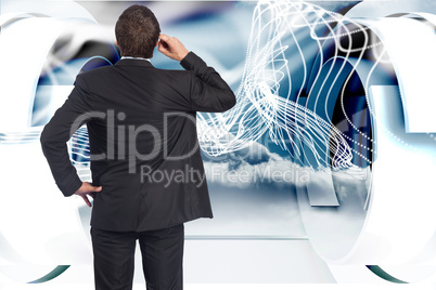 Composite image of thinking businessman scratching head