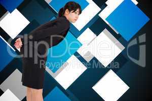 Composite image of serious businesswoman bending