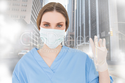 Composite image of young female doctor holding a thermometer