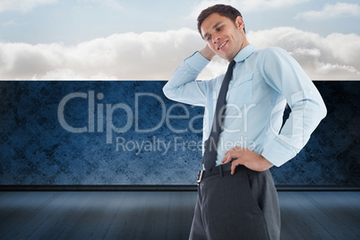 Composite image of thinking businessman with hand on head