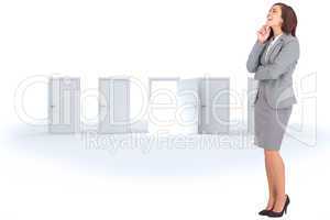 Composite image of smiling thoughtful businesswoman