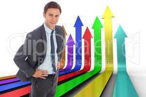 Composite image of cheerful businessman standing with hands on h