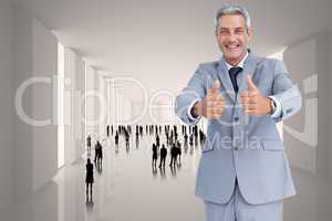 Composite image of positive handsome businessman