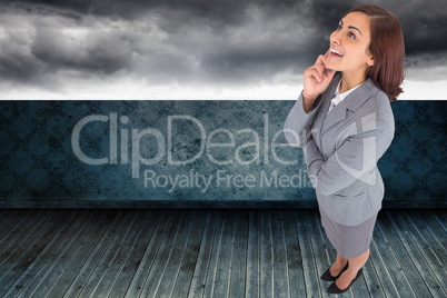 Composite image of smiling thoughtful businesswoman