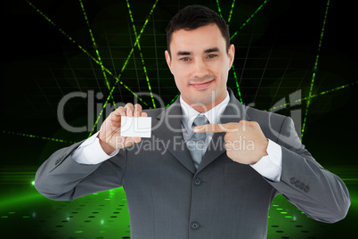 Composite image of businessman pointing at his businesscard