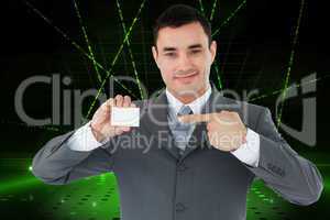 Composite image of businessman pointing at his businesscard