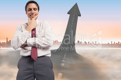 Composite image of thoughtful businessman with hand on chin