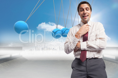 Composite image of thoughtful businessman holding pen to chin