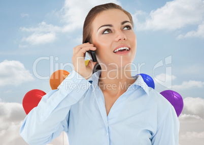 Composite image of smiling businesswoman looking upwards while o