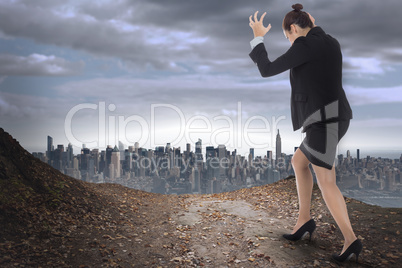 Composite image of businesswoman gesturing