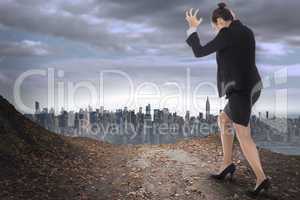 Composite image of businesswoman gesturing