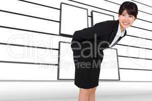 Composite image of smiling businesswoman bending