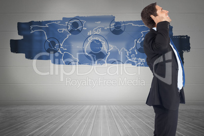 Composite image of thinking businessman scratching head