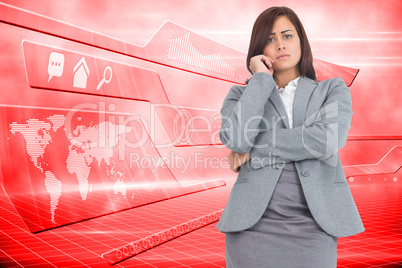 Composite image of worried businesswoman