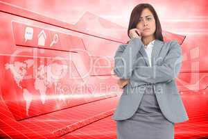 Composite image of worried businesswoman