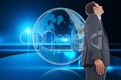 Composite image of cheerful handsome businessman standing