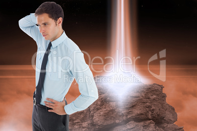 Composite image of thinking businessman scratching head