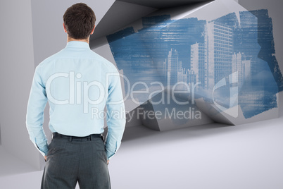 Composite image of businessman standing with hands in pockets