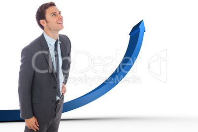 Composite image of cheerful businessman standing with hand on hi