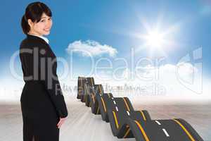 Composite image of smiling businesswoman