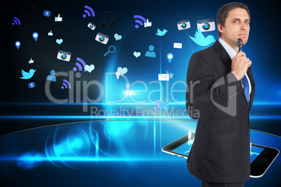 Composite image of thinking businessman holding glasses