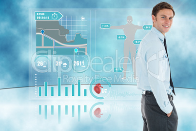 Composite image of happy businessman standing with hand in pocke