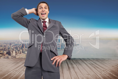 Composite image of thinking businessman scratching head