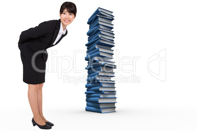 Composite image of smiling businesswoman bending