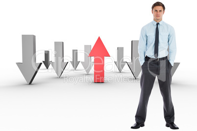 Composite image of serious businessman standing with hands in po