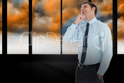 Composite image of thoughtful businessman with hand on chin