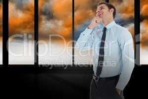 Composite image of thoughtful businessman with hand on chin