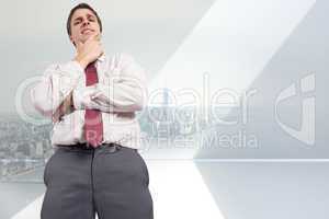 Composite image of thoughtful businessman with hand on chin