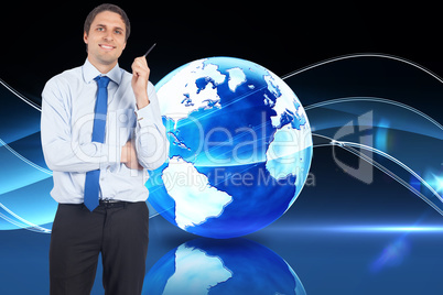 Composite image of thinking businessman holding pen