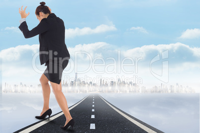 Composite image of businesswoman gesturing