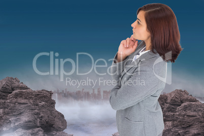 Composite image of focused businesswoman