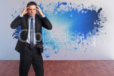 Composite image of stressed businessman with hands on head