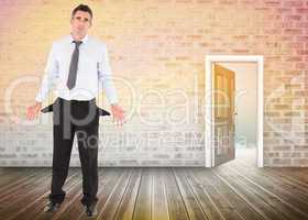 Composite image of businessman with empty pockets