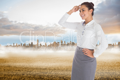 Composite image of smiling thoughtful businesswoman