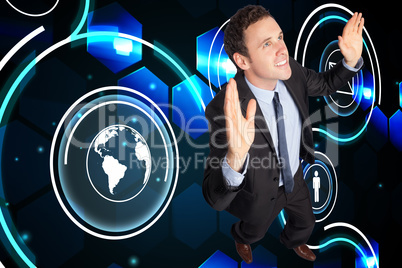 Composite image of businessman posing with arms raised