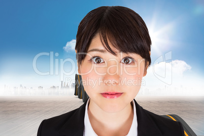 Composite image of serious businesswoman