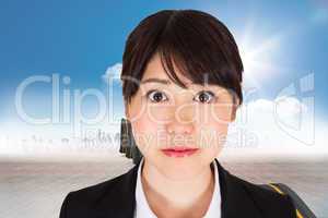 Composite image of serious businesswoman