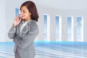 Composite image of smiling thoughtful businesswoman